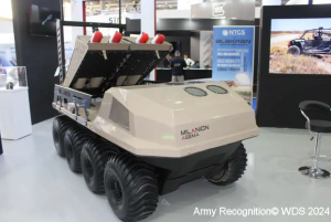 Image of the AGEMA Unmanned Ground Vehicle (UGV) with the MSP WarbleFLY loitering Munition Multi-Launcher Payload attached